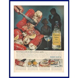 May include: A vintage advertisement for Seagram's Golden Gin featuring a close-up of a plate of cooked lobster with a knife cutting into it. The ad text reads "See the fragrant world of herbs and infusions sparkle..." and "Seagram's Golden Gin."