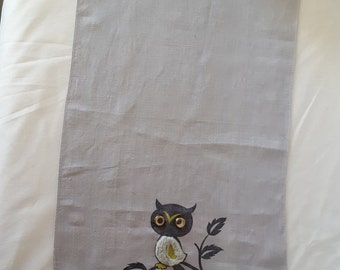 Owl tea towel with grey back ground, wiggly eyes and tufted body.