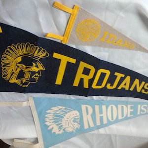Felt Pennants: two vintage felt pennants , Torjans of Owosso, and the University of Idaho