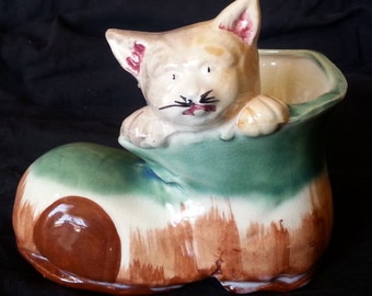 Charming calico cat in a shoe planter that was made in Japan