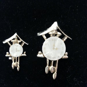 Cluster pin, vintage gold tone cuckoo clock cluster pins with mother of pearl faces