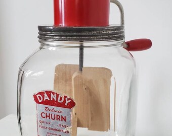 Antique Dandy Churn by Dazzy Red Handle Galvanized Metal Lid On Clear Glass Base Wooden Paddles Great Shape Turns With Ease Made in Mo USA