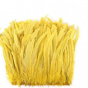 May include: A bunch of bright yellow feathers, likely for crafting or decorating.