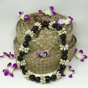 Hawaiian Kukui Nut Shell & Cowrie Shells Rosettes Lei/Necklace. Perfect Lei for wedding, luau, birthday, graduations parties. Fits All Ages.