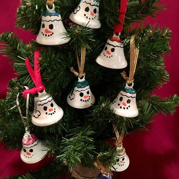Holiday liberty shaped Snowman, Snowgirl, Snowpeople bells.  Free personalization with name and year on the back of the bell.  Heirloom.
