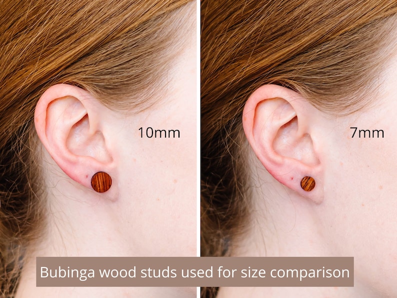 May include: Two wooden earrings in different sizes, 10mm and 7mm, shown in a person's ear for size comparison. The earrings are made of bubinga wood and have a natural wood grain.