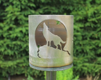 Garden torch wolf in front of the moon