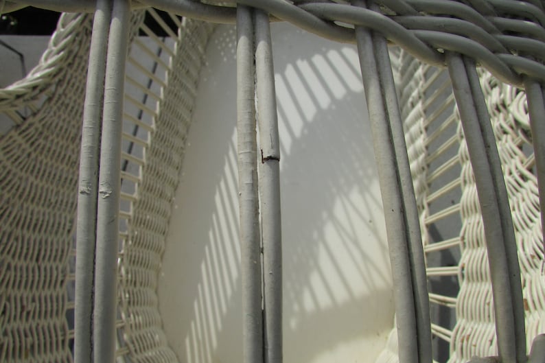 antique wicker bassinet on wheels