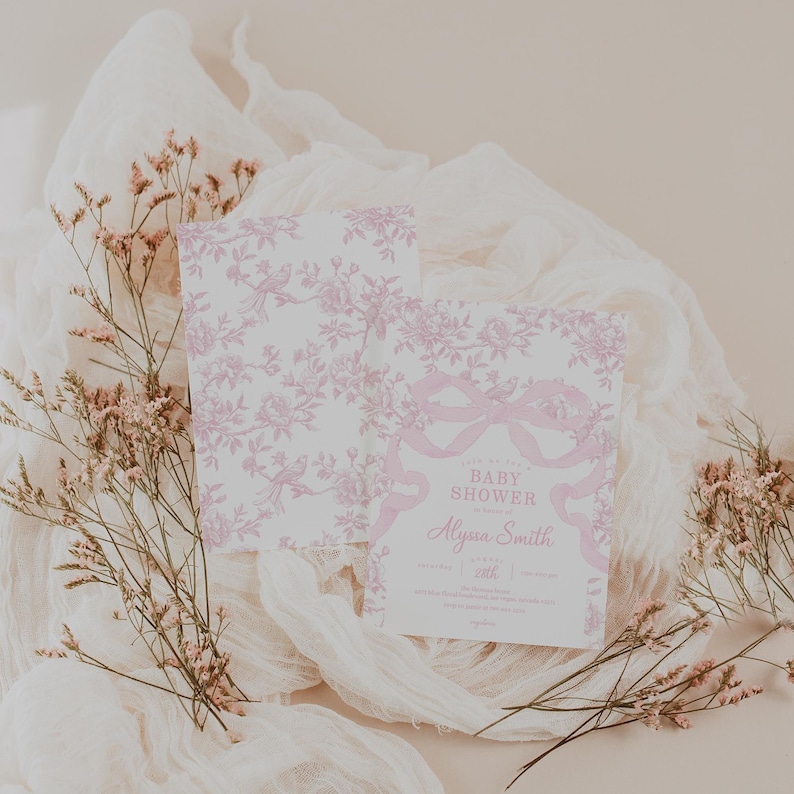 May include: Baby shower invitation with a pink floral and ribbon design. The invitation includes the text "Baby Shower" and the name "Alyssa Smith". The invitation is on a white background with pink floral accents.