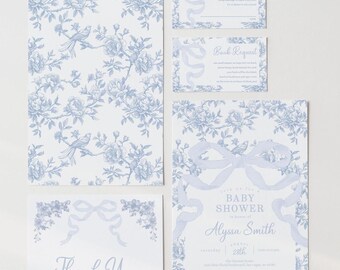 May include: A set of blue and white baby shower invitations with a floral pattern and a blue ribbon bow. The invitation says "Save the Date for a Baby Shower in honor of Alyssa Smith, Saturday, August 22nd".