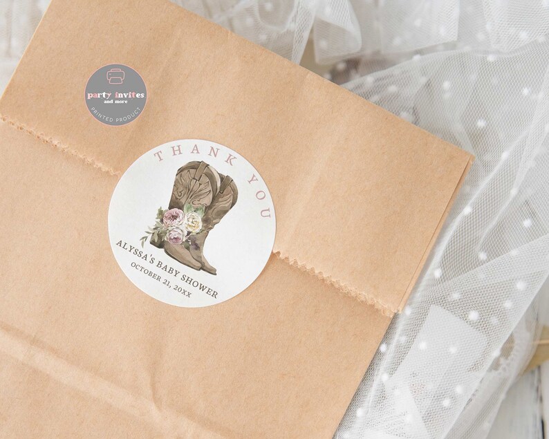 May include: Round white thank you sticker with a brown cowboy boot with pink flowers and the text "Thank You" in pink. The text "Alyssa's Baby Shower" and "October 21, 20XX" is also on the sticker.