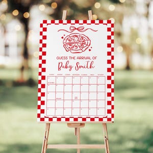 May include: A white sign with a red checkered border and a calendar grid. The sign reads "Guess the Arrival of Baby Smith" with a pizza graphic. The sign is displayed on a wooden easel.