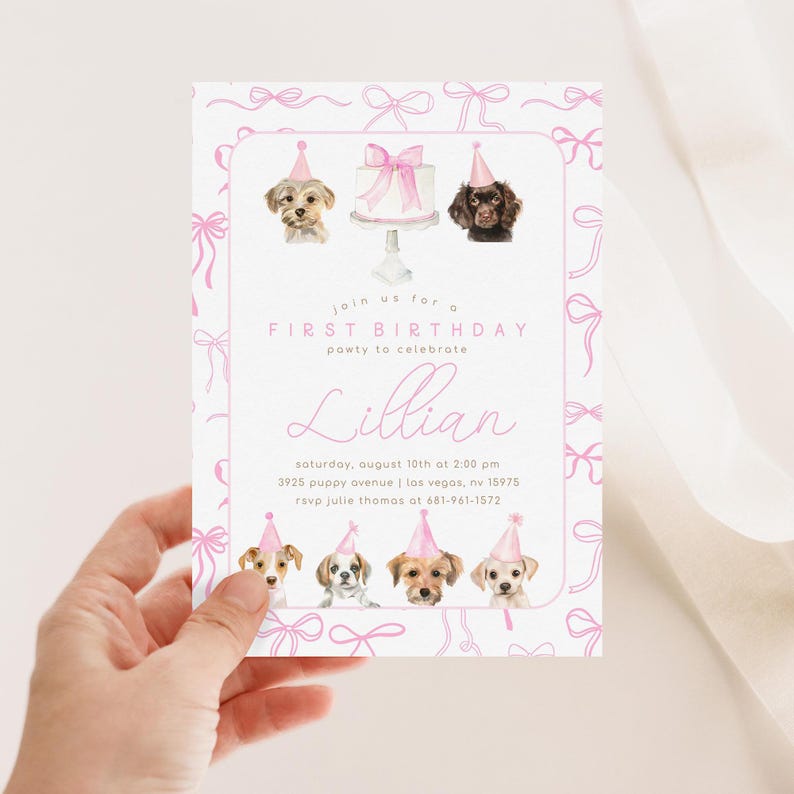 May include: Pink and white first birthday party invitation with a watercolor illustration of dogs wearing party hats and a cake. The invitation includes the text "Join us for a First Birthday party to celebrate Lillian" and the date, time, address, and RSVP information.