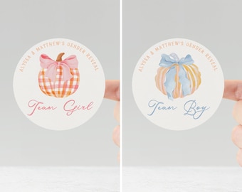 May include: Two round stickers for a gender reveal. One features a pumpkin with a pink bow and the text "Team Girl." The other has a pumpkin with a blue bow and the text "Team Boy." Both have the text "Alyssa & Matthew's Gender Reveal."