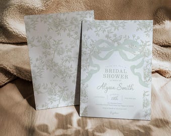 May include: A white bridal shower invitation with a floral pattern and a green ribbon. The invitation reads "Join us for a Bridal Shower in honor of Alyssa Smith, Saturday, August 28th, 2018 at 4:00 pm, The Diamond House, 5410 Main Street, Downtown, NY 12345, RSVP to [email protected] by August 20th,  Regards."