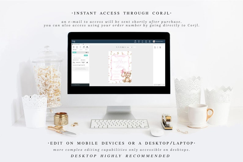 May include: A computer screen displaying a pink and gold printable invitation with a teddy bear and the text "First Birthday". The invitation is being edited on the Corjl website. The computer is on a white desk with a keyboard, a stapler, and a pair of scissors.