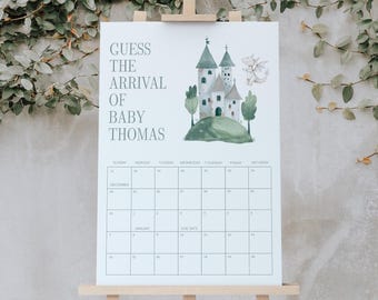 May include: A white calendar with the text "GUESS THE ARRIVAL OF BABY THOMAS" and a watercolor illustration of a castle. The calendar is displayed on a wooden easel, with a background of greenery.