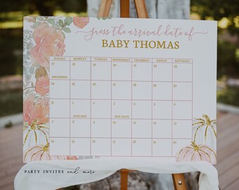 Op de afbeelding: Een rechthoekig bord met een kalender getiteld Guess the arrival date of BABY THOMAS. Het ontwerp bevat aquarel bloemenaccenten in perzik en groen, en witte pompoenen met gouden glitterstelen. Het raster toont de data van december tot januari.
