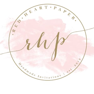 May include: A gold circle logo with the text "RED.HEART.PAPER." and "Handmade Invitations | est. 2012" around a pink watercolor background. The text "rhp" is written in cursive inside the circle.