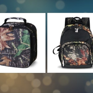 May include: A lunch bag and a backpack, both featuring a camouflage pattern with brown, green, and black leaf and branch designs. The lunch bag has a handle and a zipper closure. The backpack has adjustable straps, a front pocket, and a side pocket.