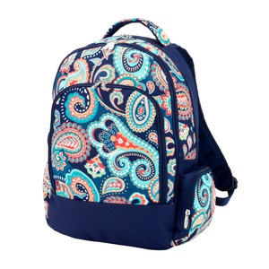May include: A navy blue backpack with a colorful paisley pattern in teal, orange, and coral. The backpack has multiple zippered compartments, a top handle, and adjustable shoulder straps. The bottom and back are solid navy blue.