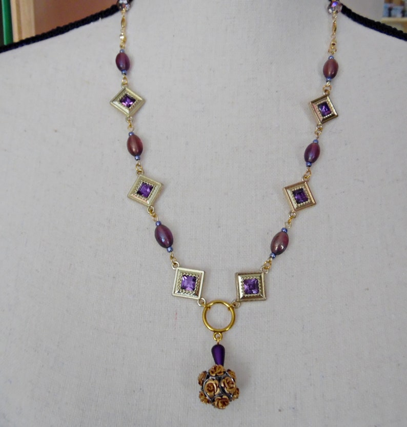 Purple and Goldtone Diamond Shaped Necklace with Rose Ball Bead