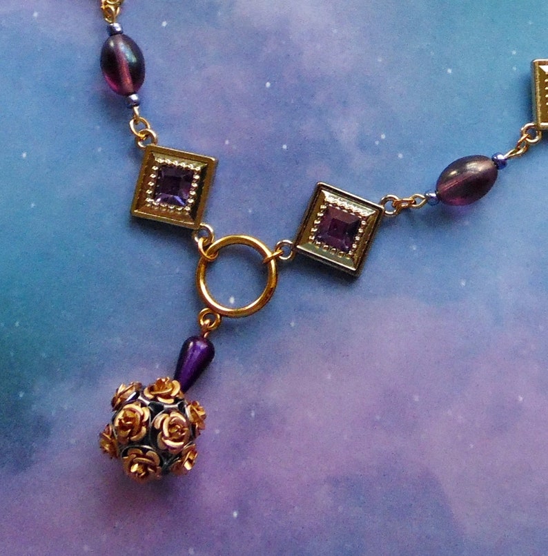 Purple and Goldtone Diamond Shaped Necklace with Rose Ball Bead
