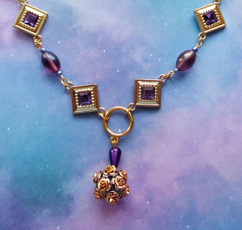 Purple and Goldtone Diamond Shaped Necklace with Rose Ball Bead