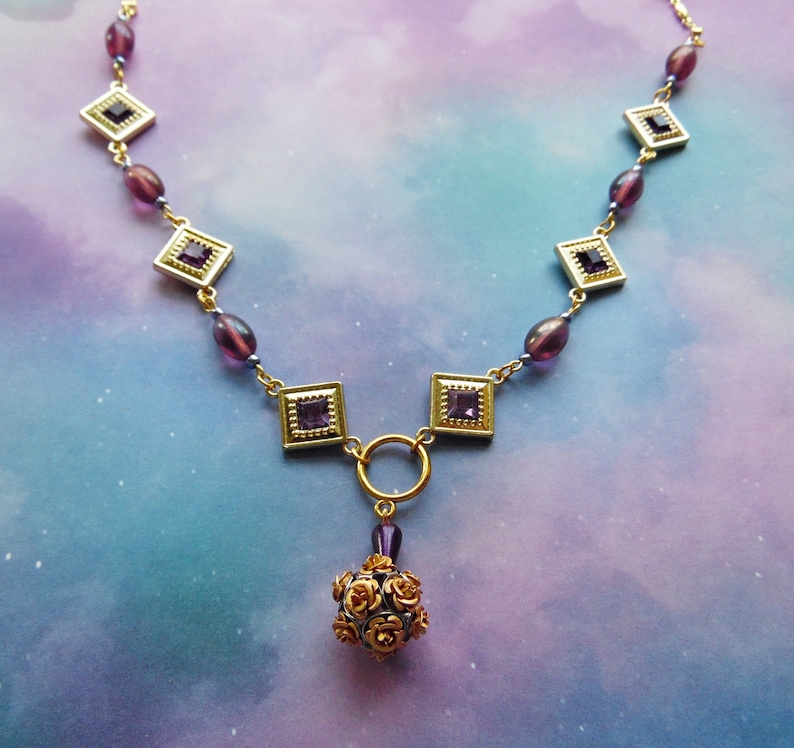 Purple and Goldtone Diamond Shaped Necklace with Rose Ball Bead