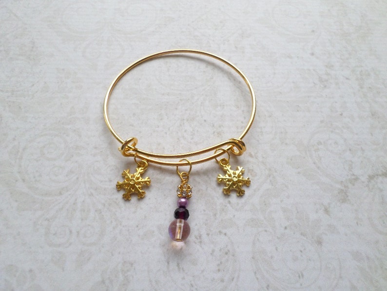 Goldtone Snowflake Charm Bracelet with Purple Bead Dangle image 2