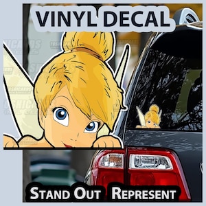 May include: A vinyl decal featuring a cartoon image of a blonde fairy with blue eyes. The decal is applied to a car window. The text "VINYL DECAL" and "STAND OUT REPRESENT" are displayed on the image.