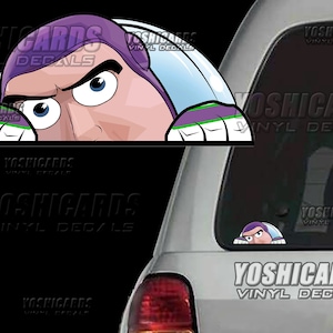 May include: A vinyl decal featuring a cartoon image of Buzz Lightyear peeking over an edge. The decal shows Buzz's face, with his purple space ranger helmet and determined expression. The text "YOSHICARDS VINYL DECALS" is also visible.