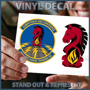May include: Vinyl decal featuring two designs: one with a red horse emblem, the text "COMPETENCE AND CONFIDENCE", and "RED HORSE TRAINING SQ". The other design is a red horse emblem. The text "STAND OUT & REPRESENT" is also visible.