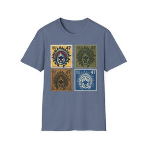 May include: A blue t-shirt featuring four postage stamp designs. Each stamp has a Native American headdress design, the number 47, and the text "U.S. Postage". The stamps are in yellow, green, brown, and blue.