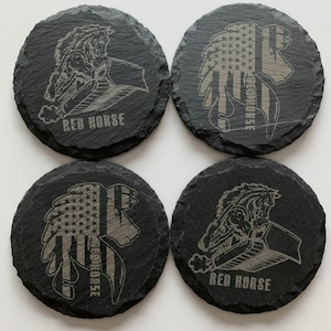May include: Four round black slate coasters. Two coasters feature a horse and bulldozer design with the text "RED HORSE". The other two coasters feature a horse head with an American flag design and the text "RED HORSE".