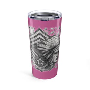 May include: A pink 20-ounce tumbler with a silver lid. The tumbler features a detailed pencil drawing of a Native American woman wearing a feathered headdress, with floral accents and a star emblem. The design is set against a pink background.