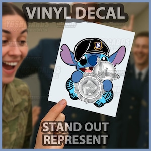 May include: A vinyl decal featuring a cartoon character wearing a black beret and holding a security police badge. The decal has the text "VINYL DECAL" at the top and "STAND OUT REPRESENT" at the bottom.