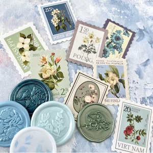 May include: A collection of vintage postage stamps and wax seals. The stamps feature floral illustrations and text, with colors including blue, green, and pink. The wax seals are in shades of blue, green, and white, with botanical designs.