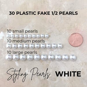 May include: White plastic half pearls in three sizes: small, medium, and large. The image shows 10 of each size, totaling 30 pearls. Text on the image reads "30 Plastic Fake 1/2 Pearls" and "Styling Pearls WHITE."