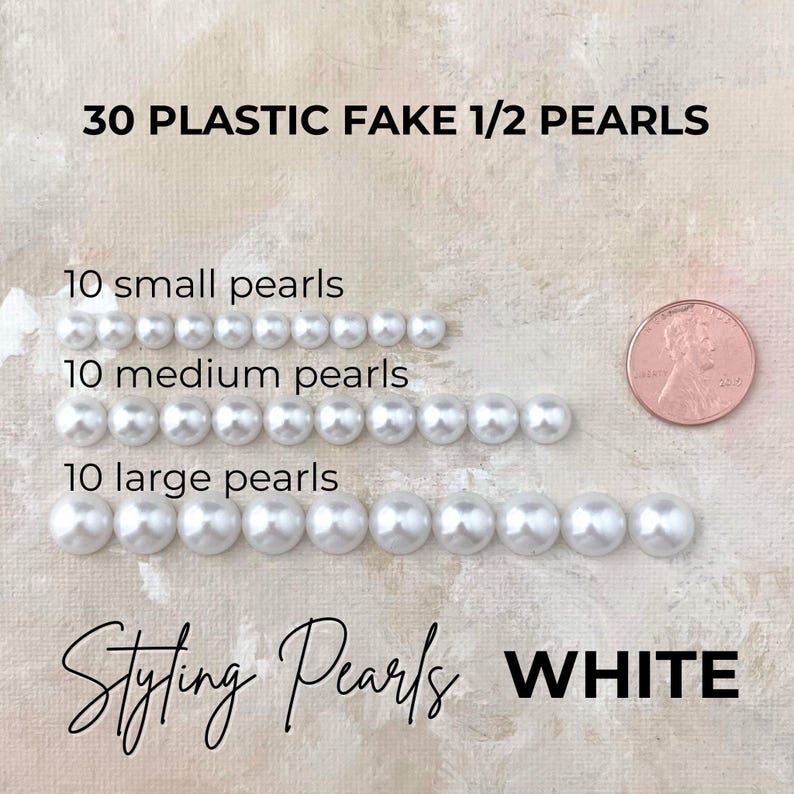 May include: White plastic half pearls in three sizes: small, medium, and large. The image shows 10 of each size, totaling 30 pearls. Text on the image reads "30 Plastic Fake 1/2 Pearls" and "Styling Pearls WHITE."