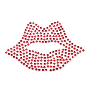 May include: Red rhinestone lips design. This is a close-up of a red rhinestone design in the shape of lips. The rhinestones are small and round, and they are arranged in a pattern that creates the shape of lips.