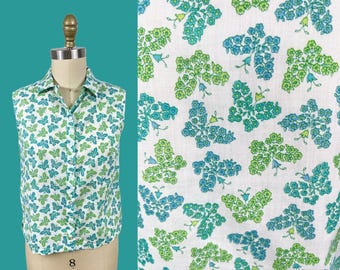 Camiseta sin mangas vintage con estampado de flores y mariposas de los años 60, en blanco, verde y azul. Talla: S/mediana