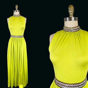 May include: A sleeveless, lime green maxi dress with a high neckline and a beaded trim around the neck and waist.