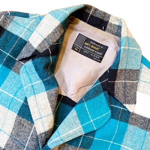 May include: A blue, black, and white plaid casual coat with a label that reads "Penney's 100% wool casual coat, size M, dry clean".