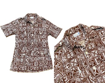 May include: Two brown and white patterned Hawaiian shirts with short sleeves and a button-up front.