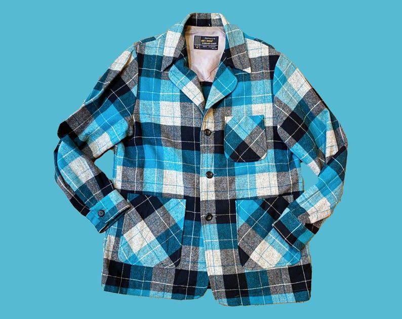 May include: A blue, black, and white plaid jacket with two pockets and a button closure.