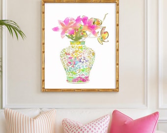 May include: A framed wall art print featuring a watercolor illustration of a decorative ginger jar filled with vibrant pink flowers and green foliage. The artwork is encased in a gold bamboo-style frame, showcasing a colorful floral arrangement.