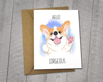 May include: A greeting card featuring a cartoon corgi dog with a blue background. The card says "Hello" and "Corgeous" in black text.