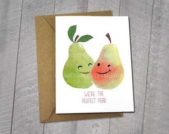 May include: A greeting card with a watercolor illustration of two pears with faces. The pears are touching and have a happy expression. The text on the card reads "We're the perfect pear". The card is 5x6.5 inches and comes with a 5x7 inch envelope.