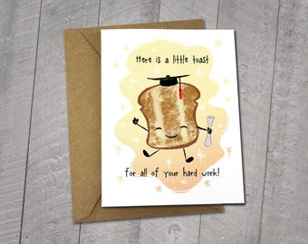 May include: A graduation card with a cute illustration of a slice of toast wearing a graduation cap and holding a diploma. The card says "Here is a little toast for all of your hard work!" and is 5x6.5 inches. It comes with a 5x7 inch envelope.